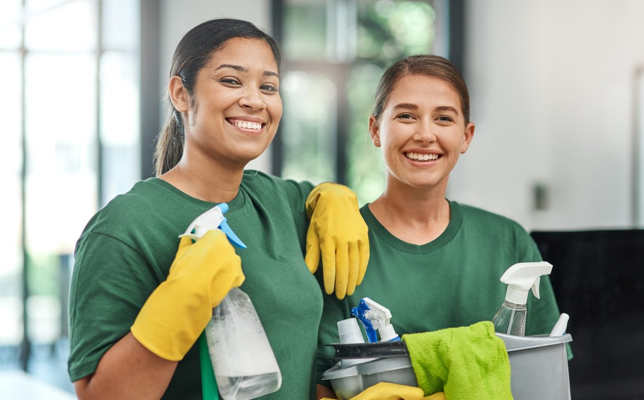 the best team to keep your office clean portrait of two young woman cleaning a modern office