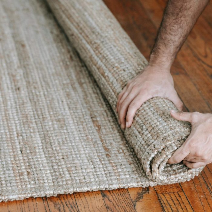 Carpet cleaning process Dubai — technician using extraction machine